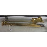 A set of Victorian brass fire irons.