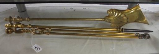 A set of Victorian brass fire irons.