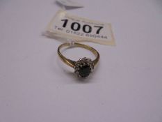 An oval diamond and sapphire 9ct gold ring, size O half, 2.2 grams.