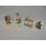 Three John Beswick Beatrix potter figures and a World of Peter Rabbit figure.