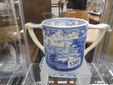 A large Wade blue and white twin handled cider tankard.