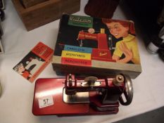 A boxed vintage Vulcan senior sewing machine