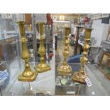 Two pairs of brass candlesticks.