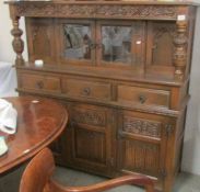A carved oak cabinet, COLLECT ONLY.