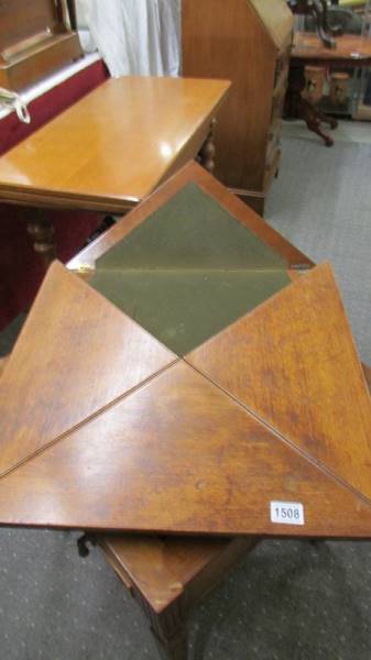 A Victorian 'envelope' fold out games table on castors, COLLECT ONLY. - Image 3 of 3