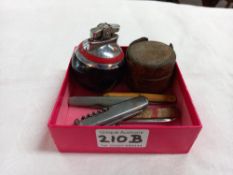 A retro lighter, old inkwell & 6 penknives