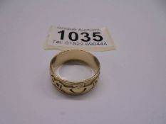 A 9ct gold Clodagh ring with motto, size R, 4.49 grams.