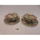 A pair of Chinese Famille Rose Bouillon cups with lids and saucers.