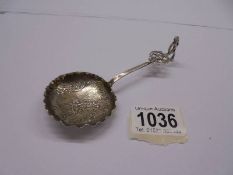 A continental silver (800) embosses collector's spoon.