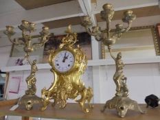 A three piece brass clock garniture. COLLECT ONLY.