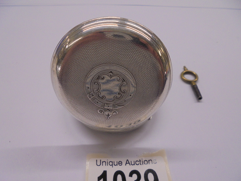 A silver pocket watch with key, in working order. - Image 2 of 3