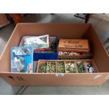A large box of plastic soldiers and military vehicles