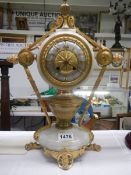 An early French gilded bronze clock, in working order. COLLECT ONLY.