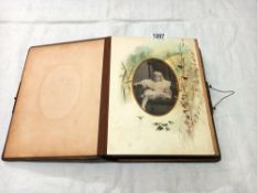 A Victorian photo album with mainly portraits