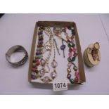 A mixed lot of costume jewellery including necklaces, bracelet, trinket box etc.,