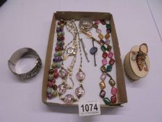A mixed lot of costume jewellery including necklaces, bracelet, trinket box etc.,