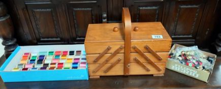 A sewing box & contents including cotton reels & buttons etc. COLLECT ONLY.