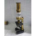 A brass student microscope.