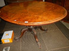 A Victorian oval walnut tip top table, COLLECT ONLY.