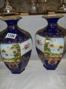 A pair of oriental vases. COLLECT ONLY.
