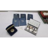 A 1976 New Zealand proof set, 1977 silver proof coin and five first decimal sets.