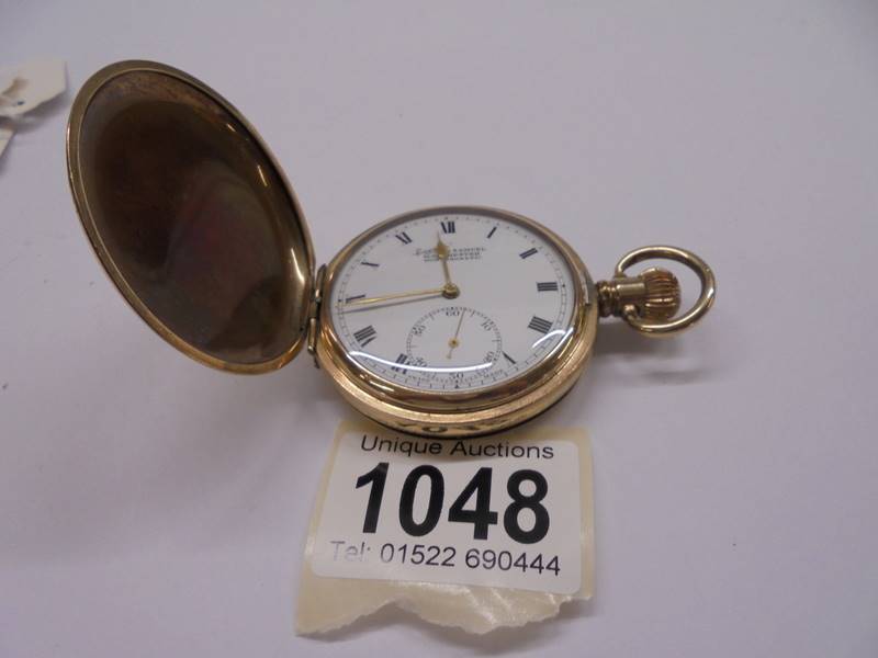 A Dennison gold plated full hunter pocket watch, in working order.