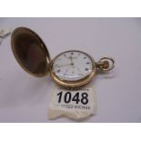 A Dennison gold plated full hunter pocket watch, in working order.