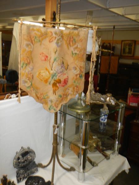 A brass pole screen with tapestry banner. COLLECT ONLY.