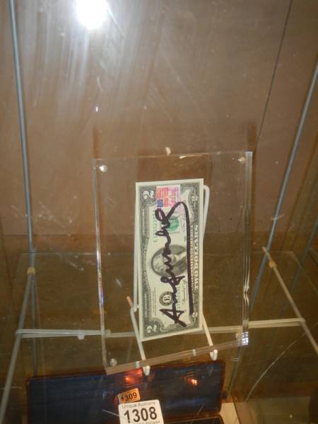 An Andy Warhol signed two dollar note with USA chemistry stamp in perspex frame with certificate