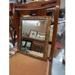 A brass framed mirror 18cm x 34cm