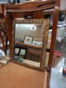 A brass framed mirror 18cm x 34cm