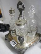 An early Victorian silver plate and glass condiment set.