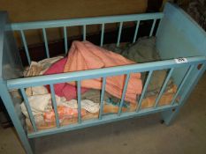 An old dolls cot and contents, COLLECT ONLY.