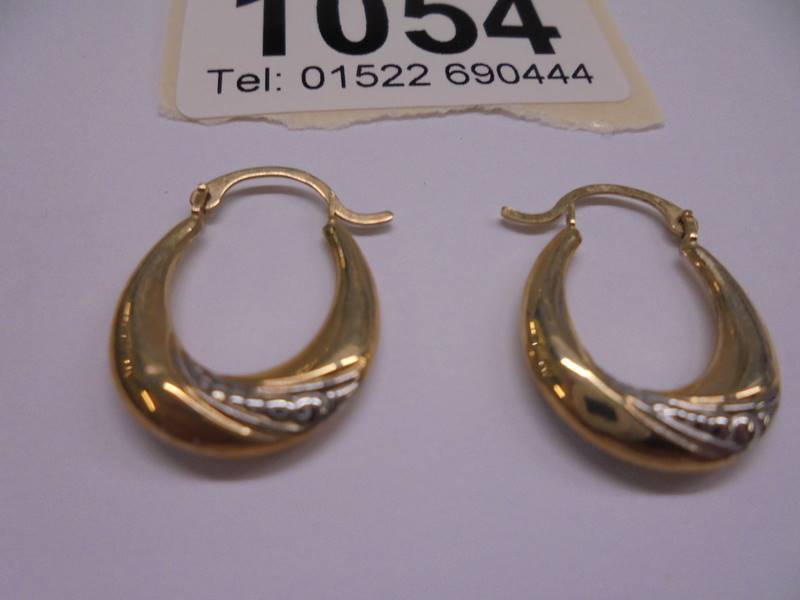 A pair of 9ct gold earrings, 0.6 grams. - Image 2 of 2