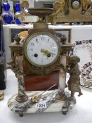 A 19th century mantel clock featuring a figure and a cherub. COLLECT ONLY.