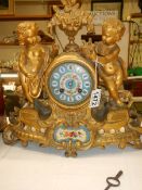 A French mantel clock with Sevres hand painted panels featuring cherubs. In working order, COLLECT