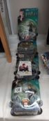 4 Harry Potter figures sealed in bubble packs and some collectors cards