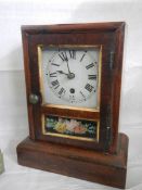 A mahogany mantel clock.