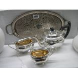 An oval silver plate tray together with a three piece silver plate tea set.