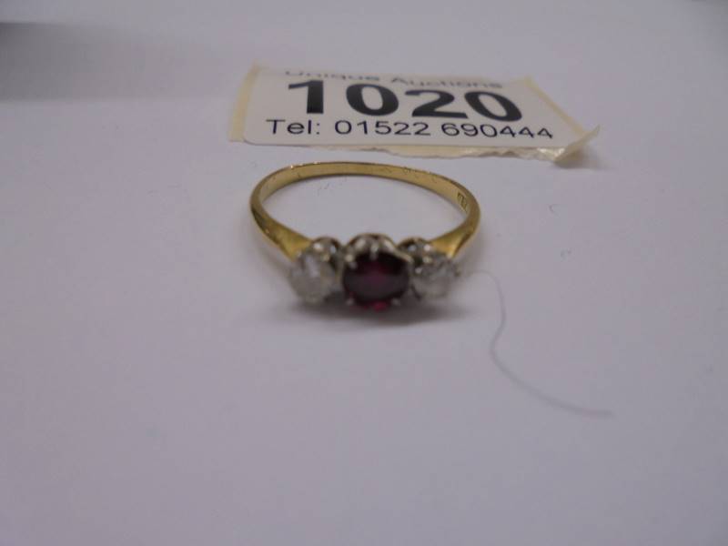 An 18ct gold set ruby and two diamonds, size M half, 1.8 grams. - Image 2 of 3