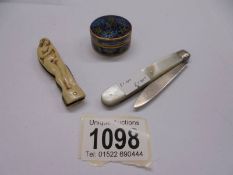 A silver penknife, a 1930's penknife with female nude and an enamel box.
