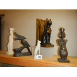 An Egyptian cat door stop and other ornaments.