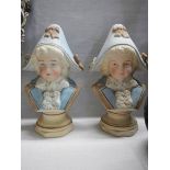 A pair of bisque porcelain paperweight in the form of busts.