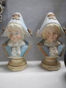 A pair of bisque porcelain paperweight in the form of busts.