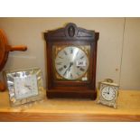 A 1930's mantel clock and two modern clocks.