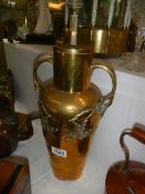 A brass table lamp base.