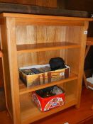 A solid oak book case. COLLECT ONLY.