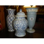 A Wedgwood glazed embossed Queensware vase and one other.
