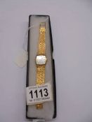 A vintage yellow metal Bulova mechanical wrist watch.