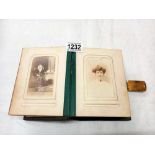 A Victorian photo album with mainly portraits